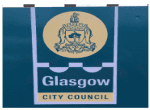 a sign attached to a fence showing Glasgow city council's logo